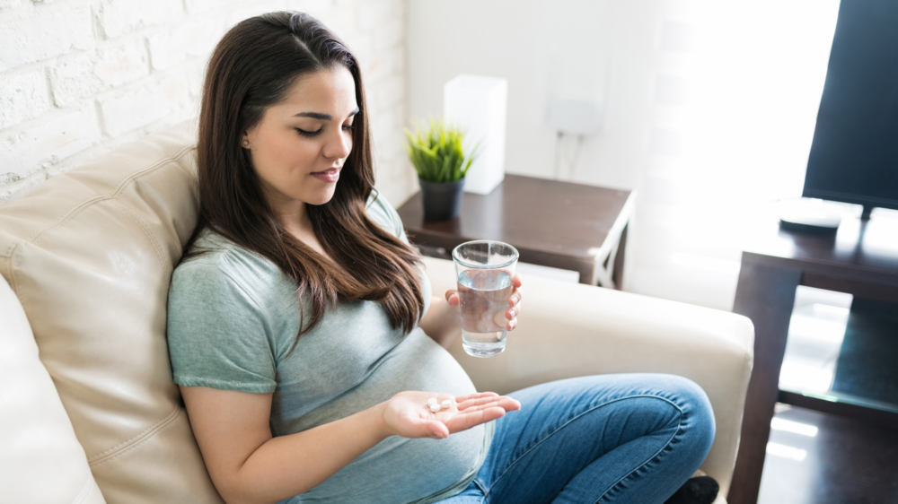 Woman taking medicine