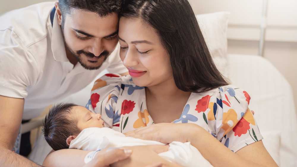 Happy couple with new baby
