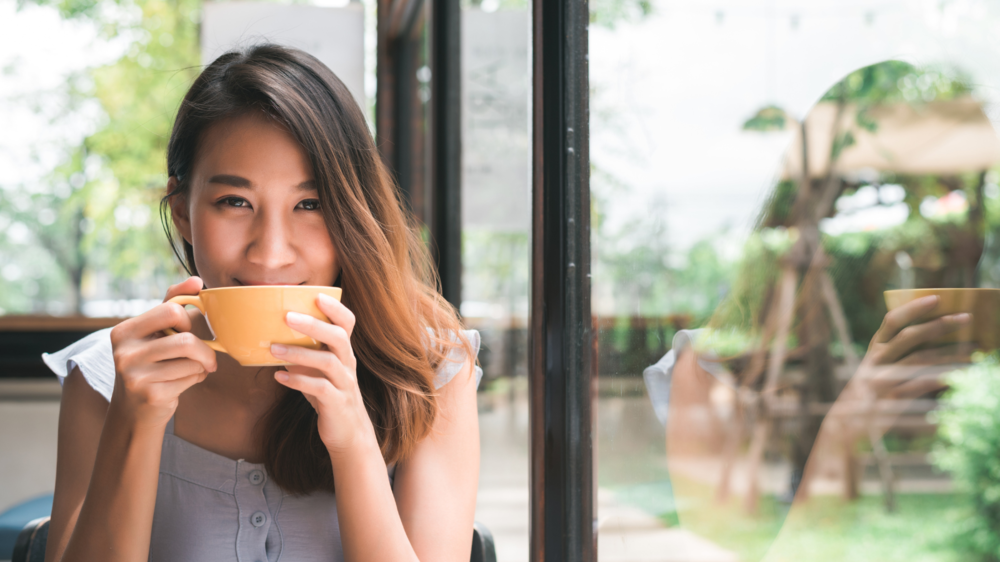 Pregnant woman having tea