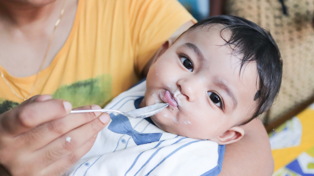 indian toddler eating