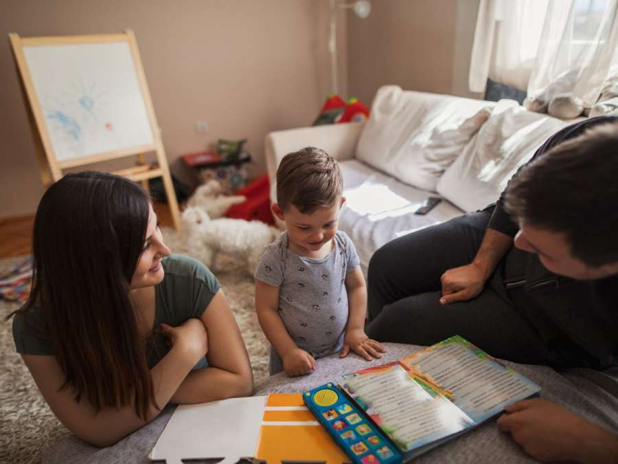 PARENTS READING STORY TO CHILD