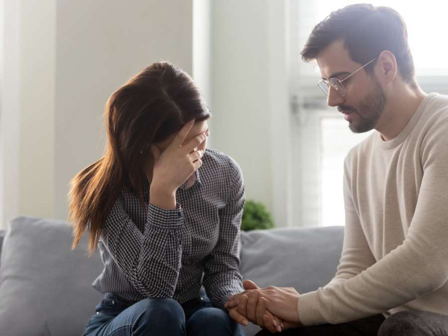 stressed couple talking-  Fertility Struggles