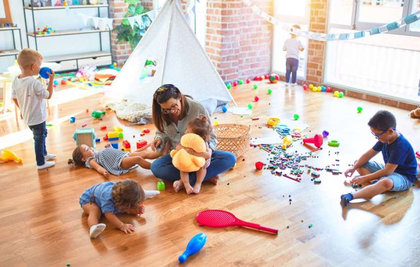 women and children are playing with toys