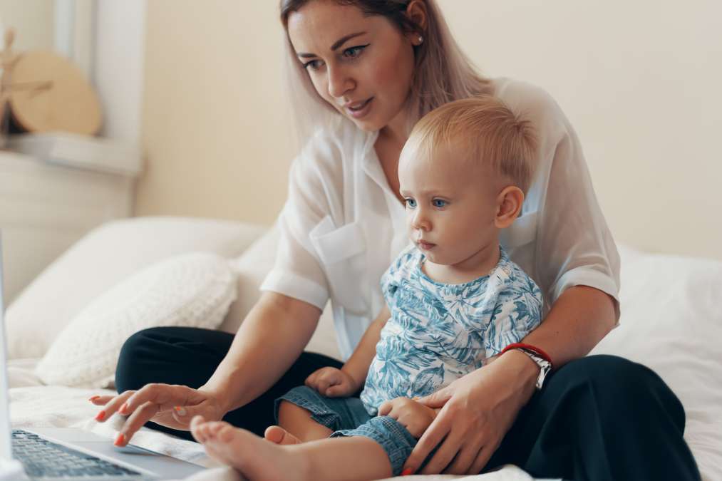 mother working and sitting with the child- Toddler's Emotional Intelligence