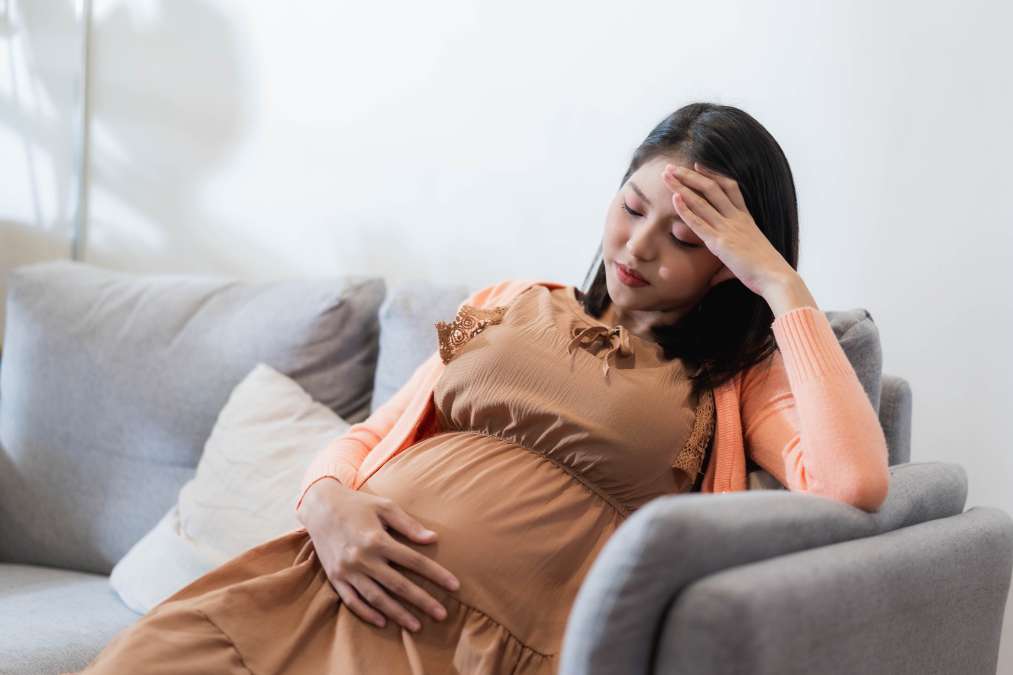 Woman stressed due to pregnancy