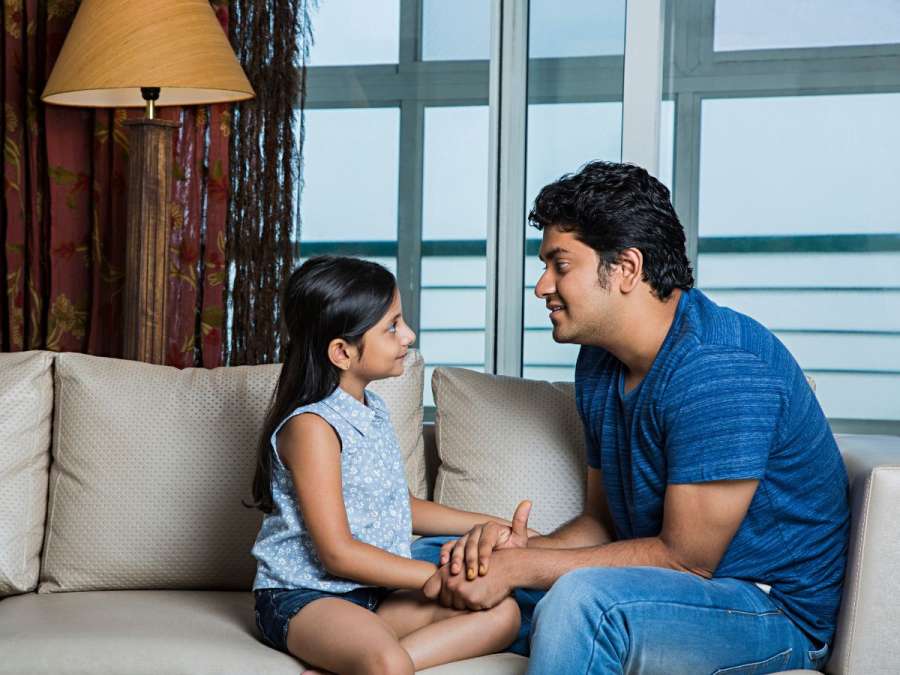 child talking to father- Listening Skills In Children