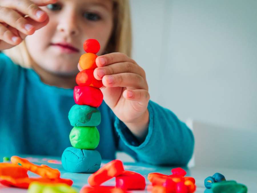 child playing with clay-Baby's Cognitive Development