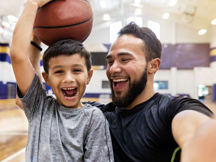 father and son with a basketball