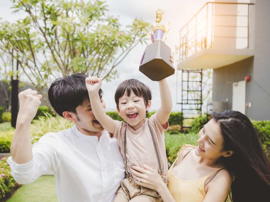 parents celebrating with child