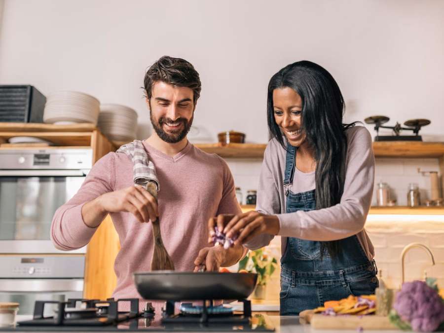 couple happily cooking together-Balanced Lifestyle