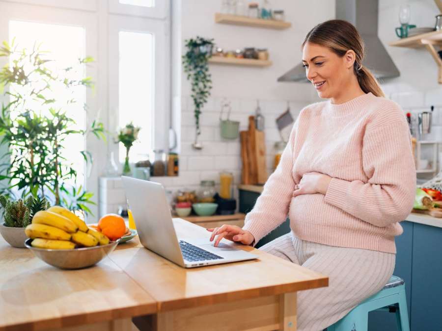 woman shopping for maternity clothing online
