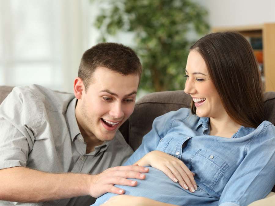 COUPLES ENJOYING BABY KICKS- Prenatal Bonding