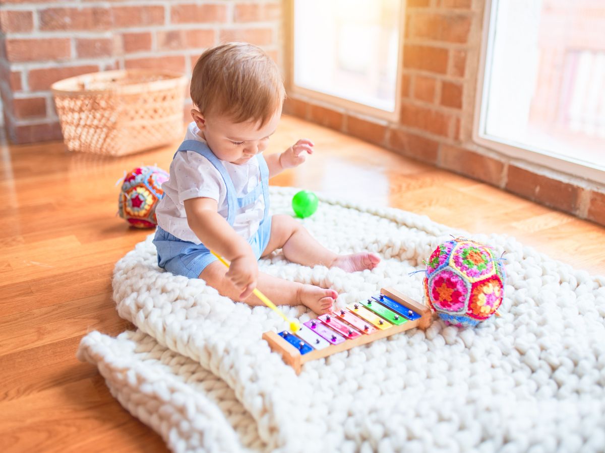 Child playing with musical toys