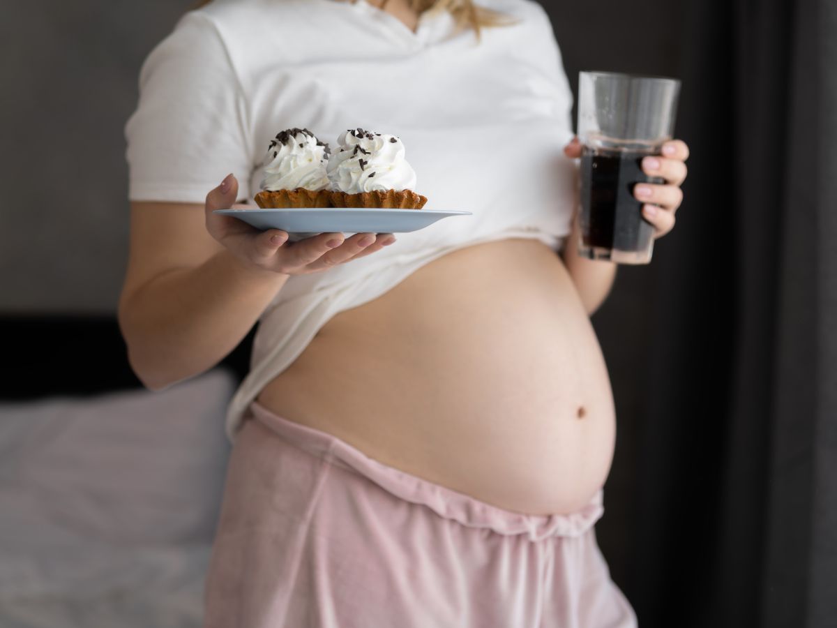 Obese pregnant woman with junk food