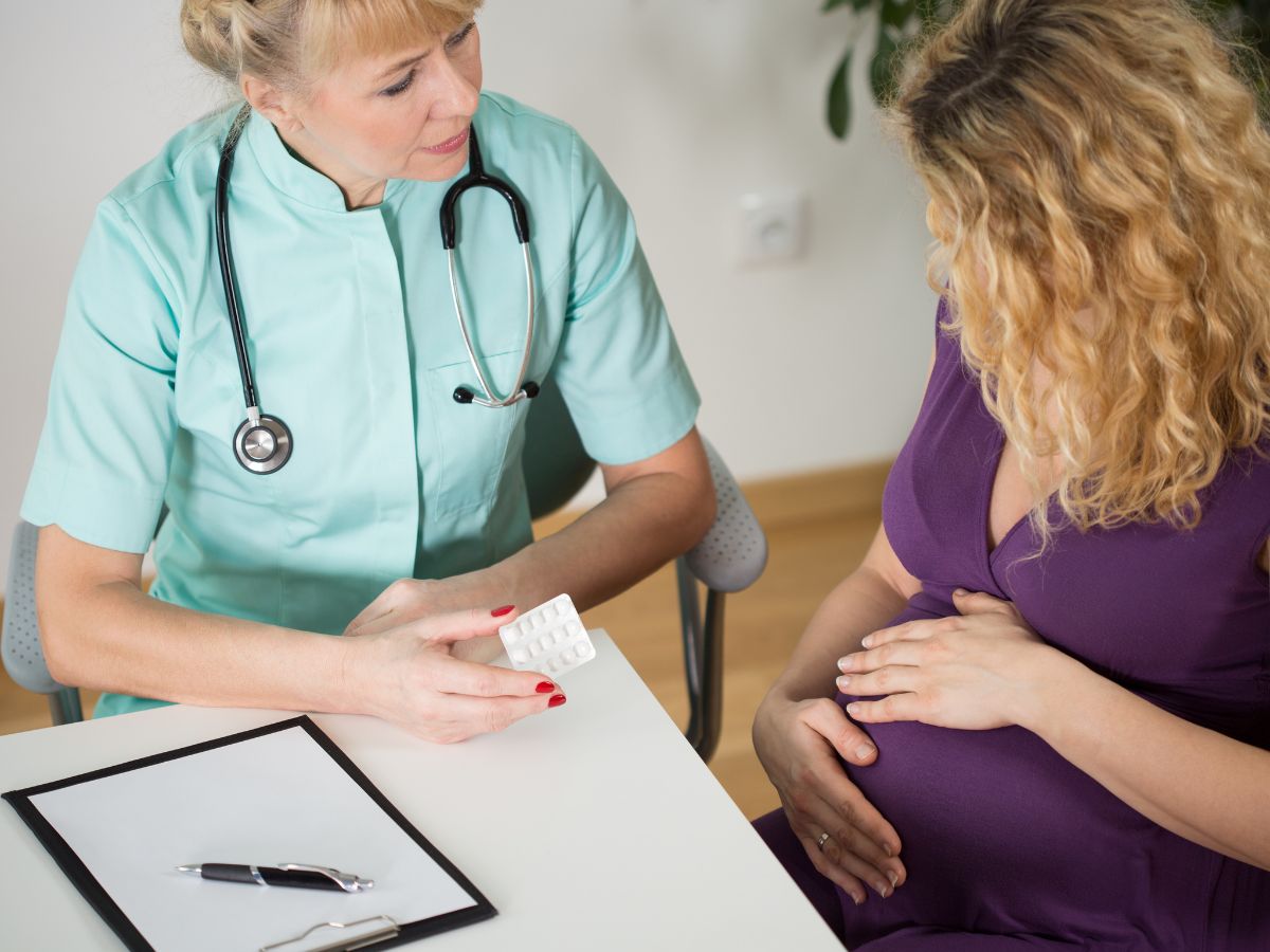 pregnant woman visiting doctor- Infections During Pregnancy