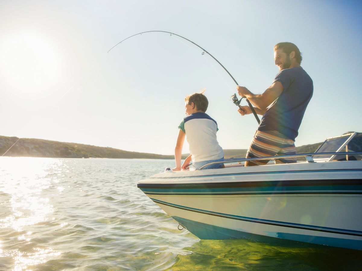 child and father fishing