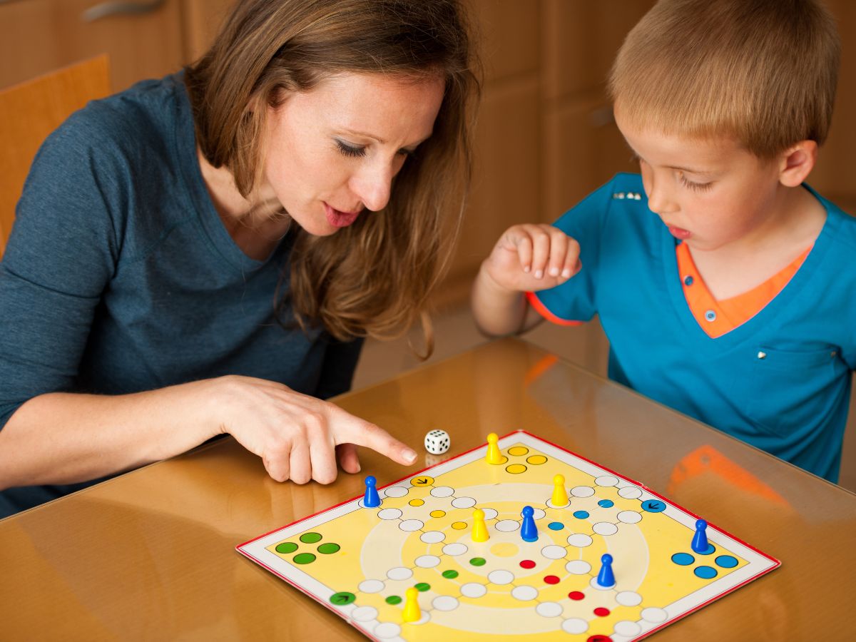 Child and mother playing a board game