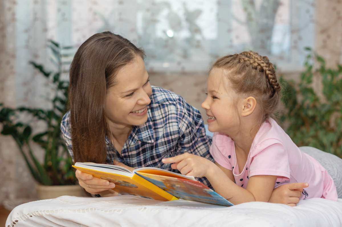 mother and daughter reading rhymes