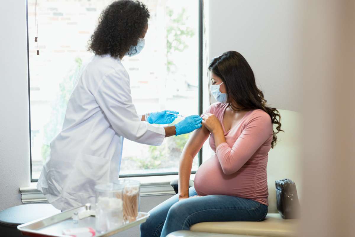 pregnant woman getting steroid injection