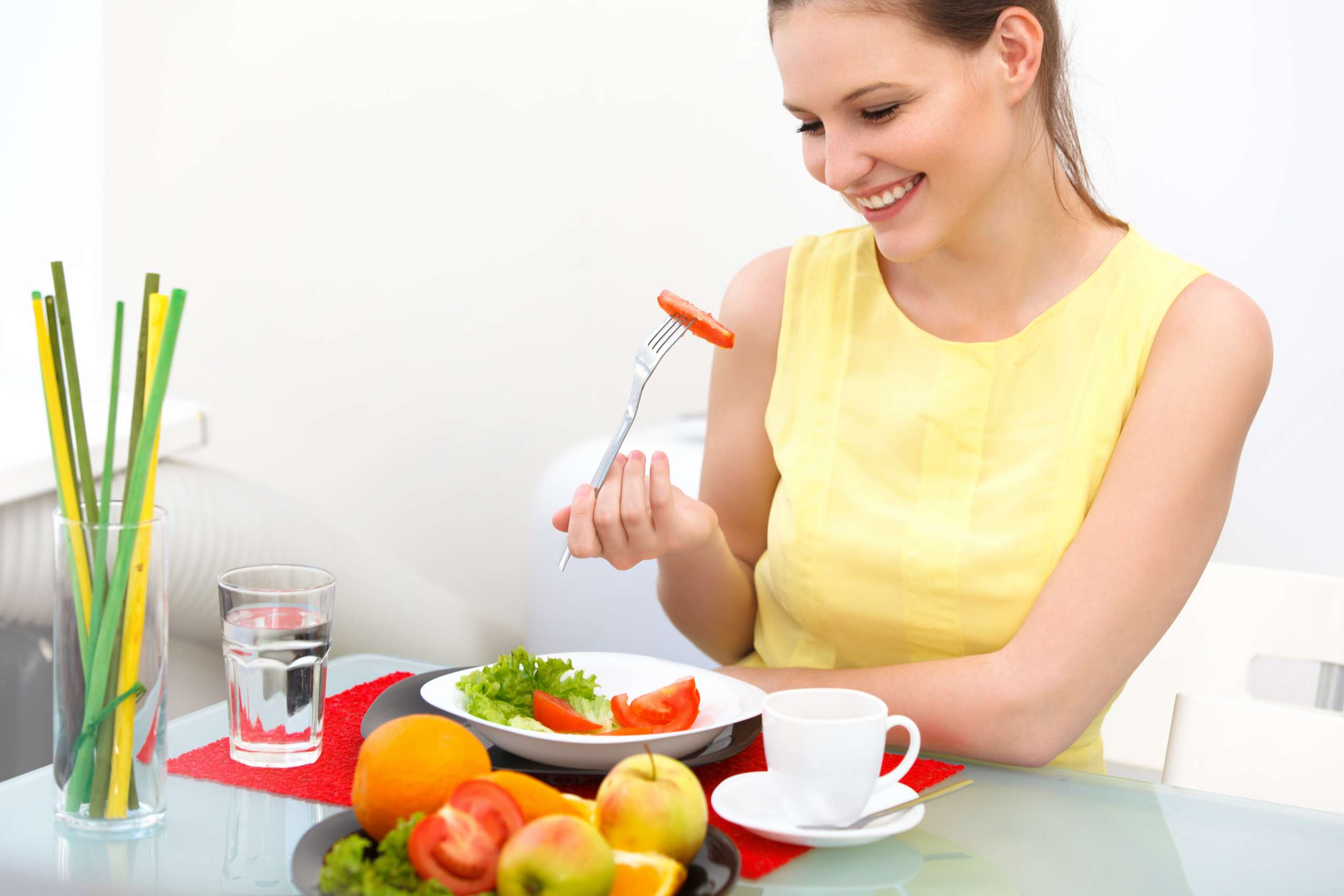 Close-up Of Beautiful Woman Eating healthy food