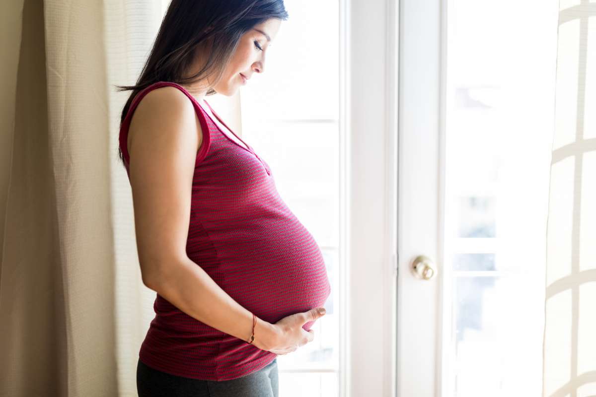 pregnant woman feeling fetal movements