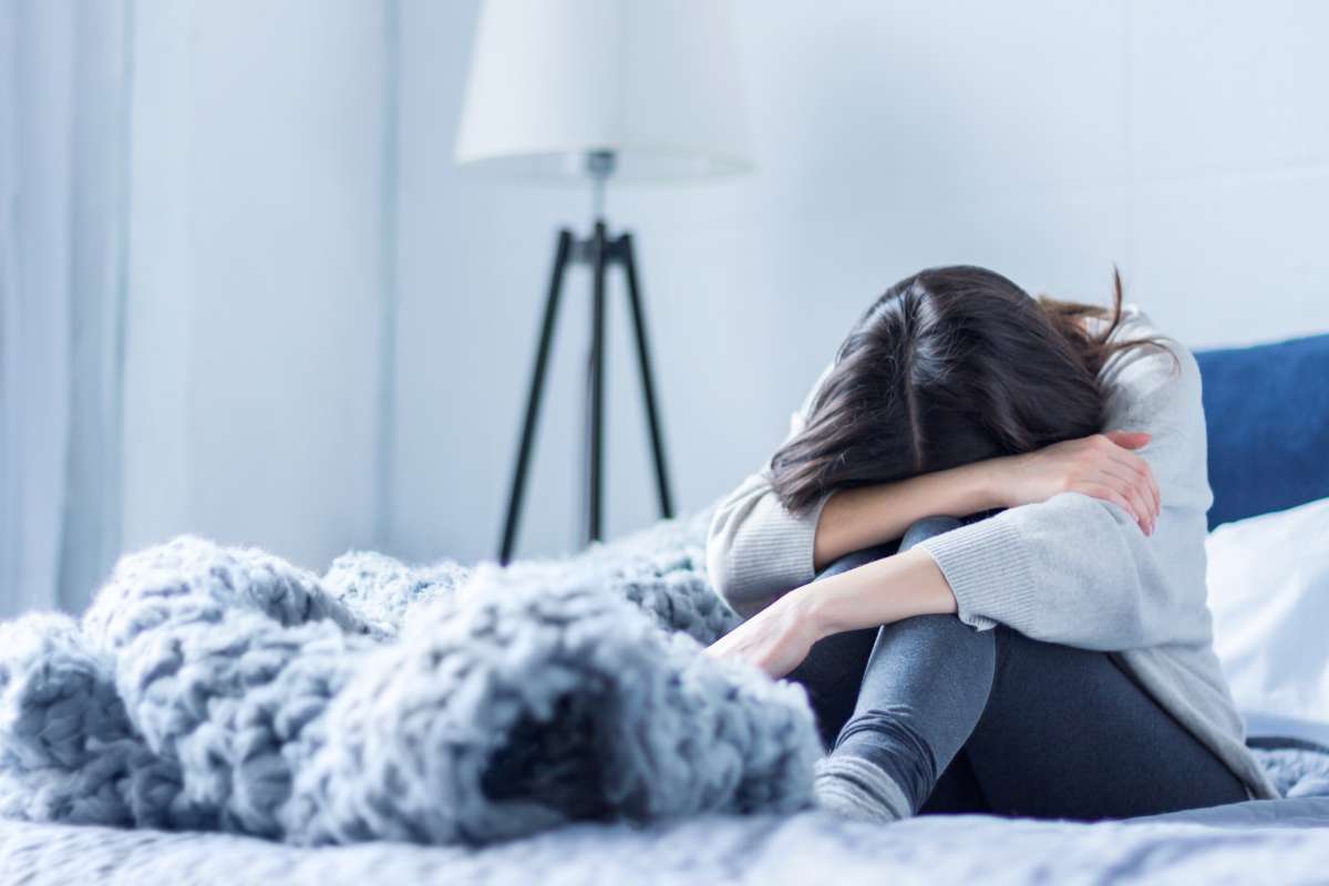 woman in depression- Risk Factors for Postpartum Depression