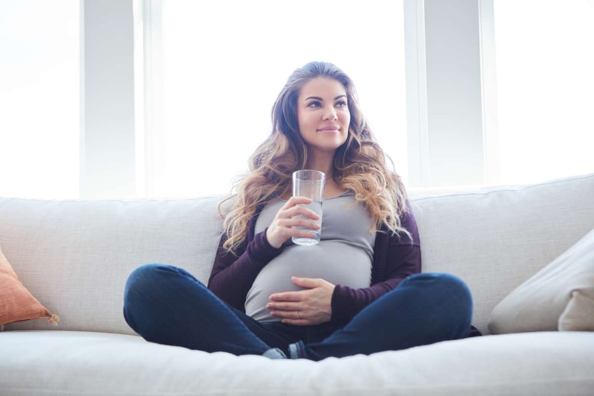 pregnant woman drinking water-Natural Ways To Induce Labor