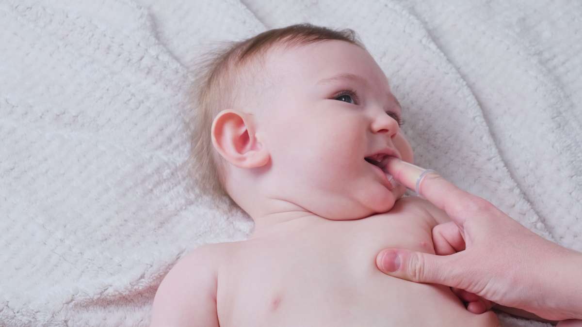 massaging baby's gums- Baby Massage Benefits