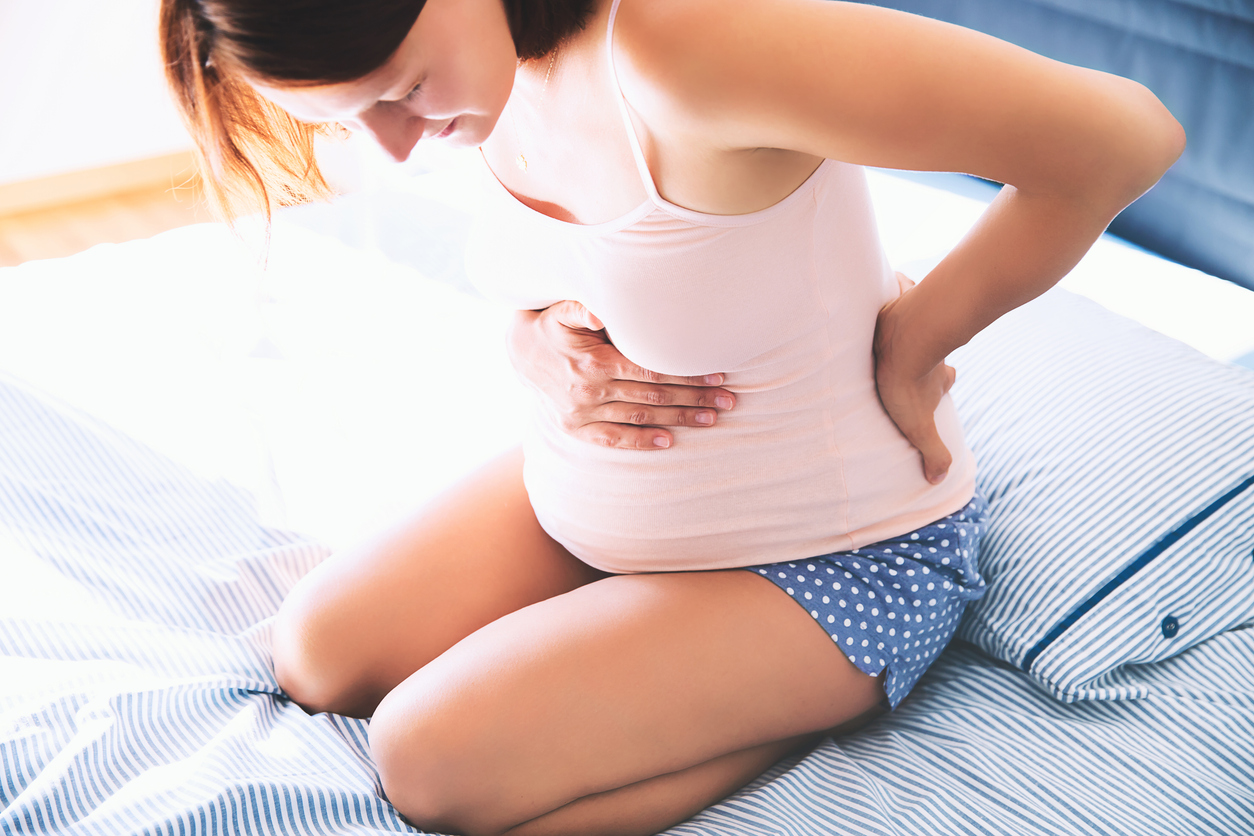 Pregnant woman suffering lower back pain- Salt In Pregnancy