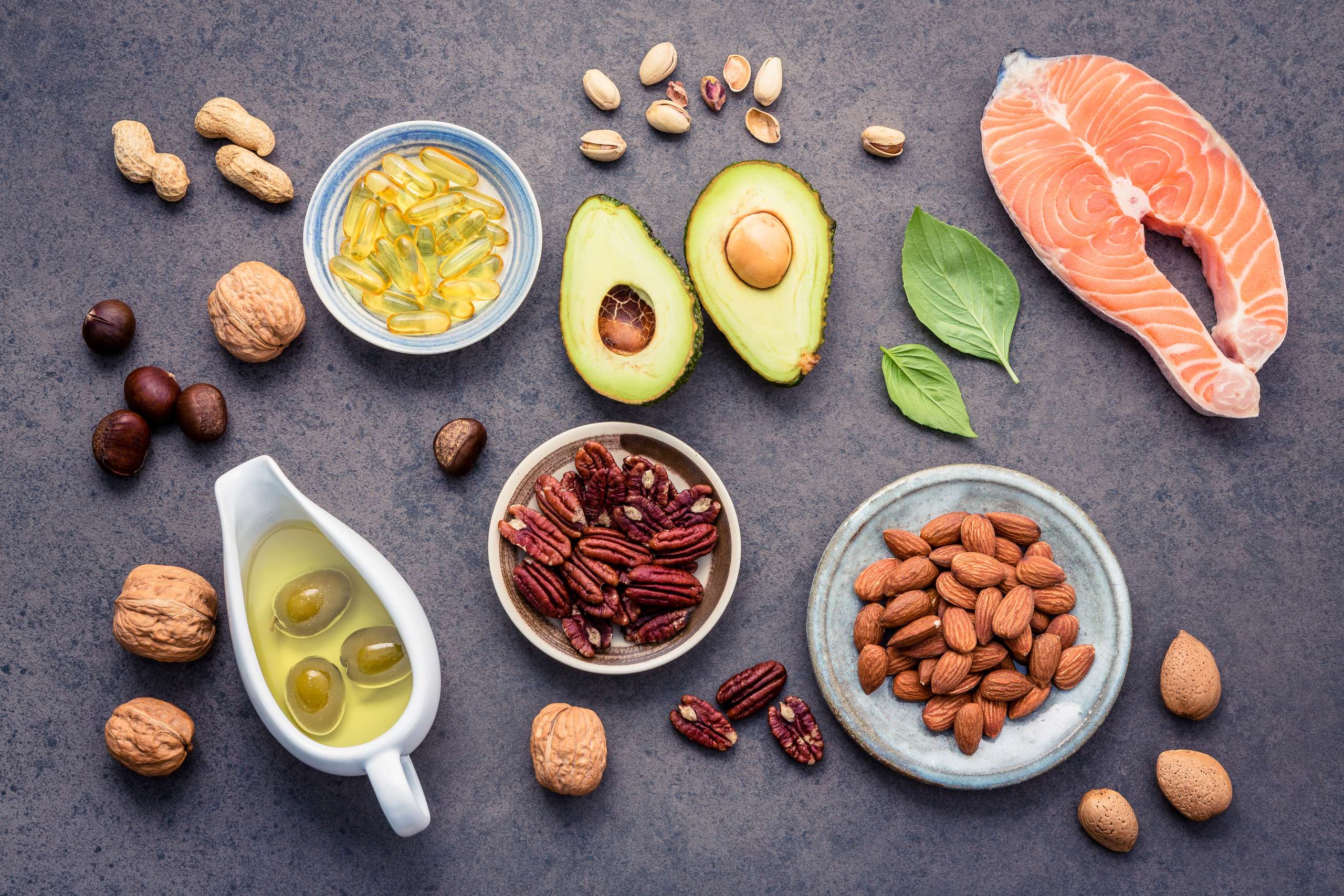 Selection food sources of omega 3 and unsaturated fats. Superfood high vitamin e and dietary fiber for healthy food. Almond ,pecan,hazelnuts,walnuts,olive oil,fish oil and salmon-  Foods For Healthy Hair