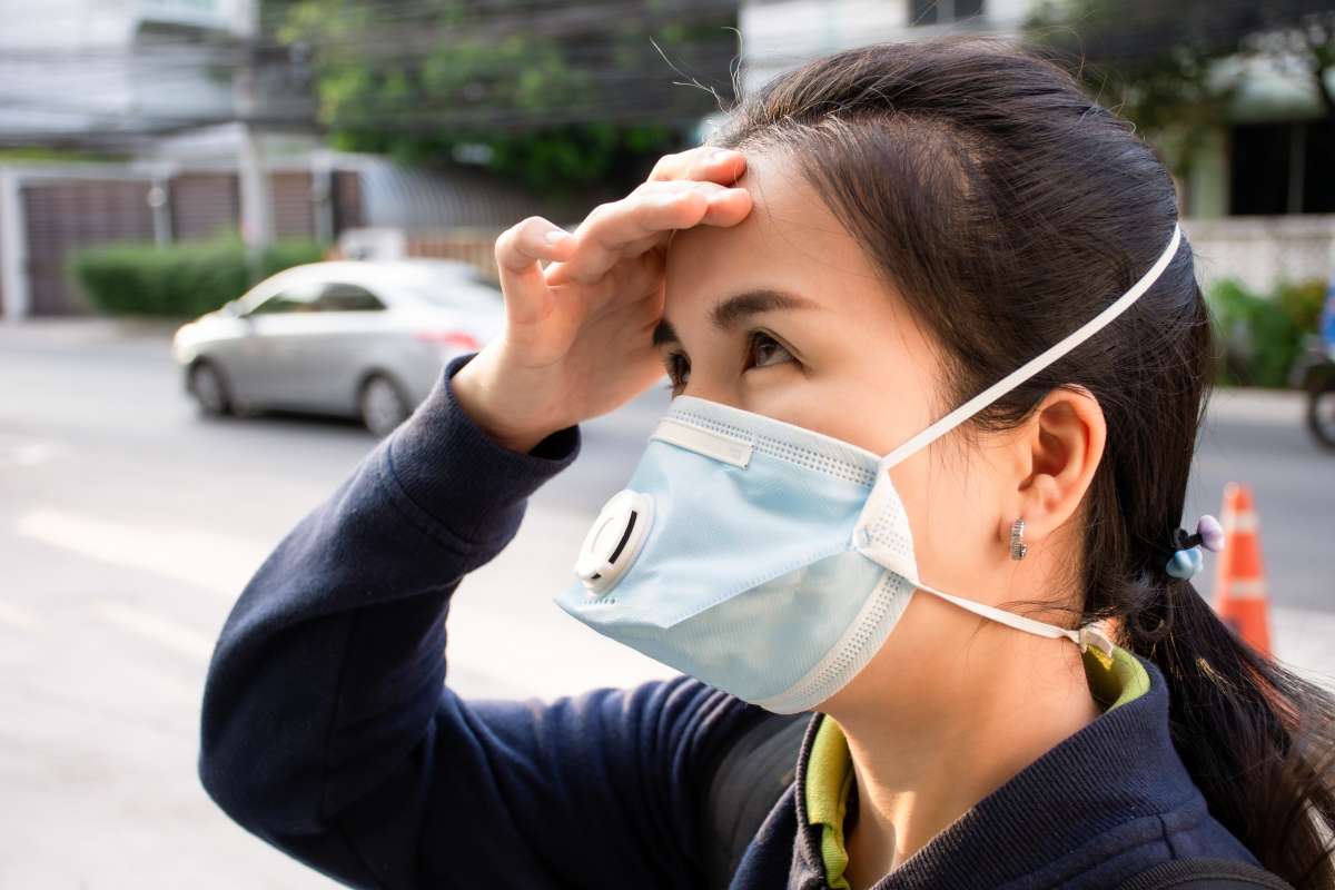 woman inhaling toxins- Maternal Exposure To Environmental Toxins