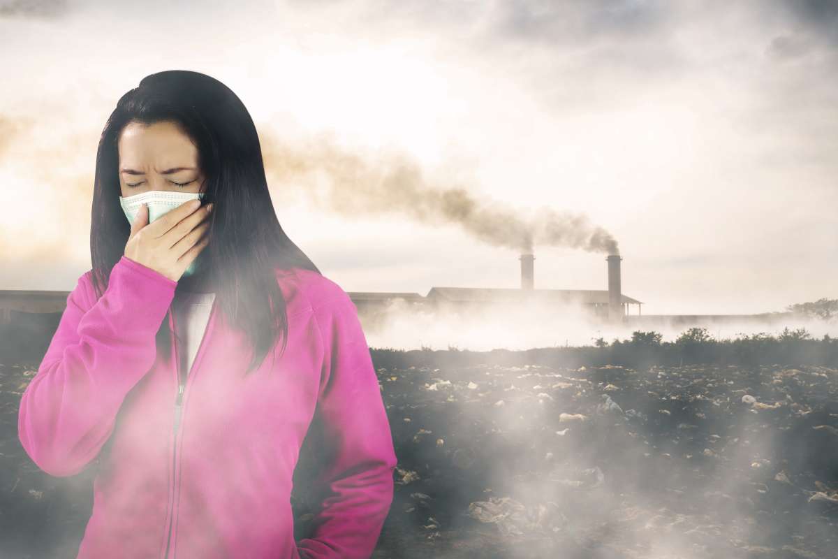 woman inhaling toxins- Maternal Exposure To Environmental Toxins
