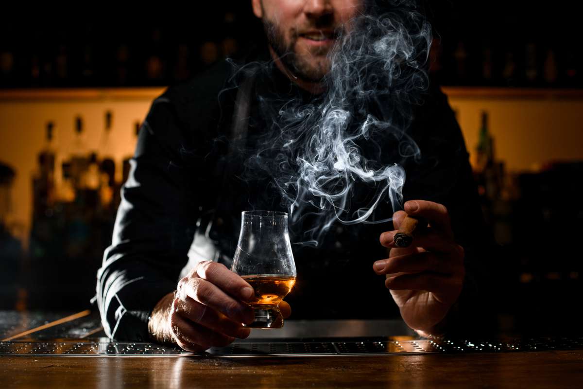 strong alcoholic drink and smoking cuban cigar