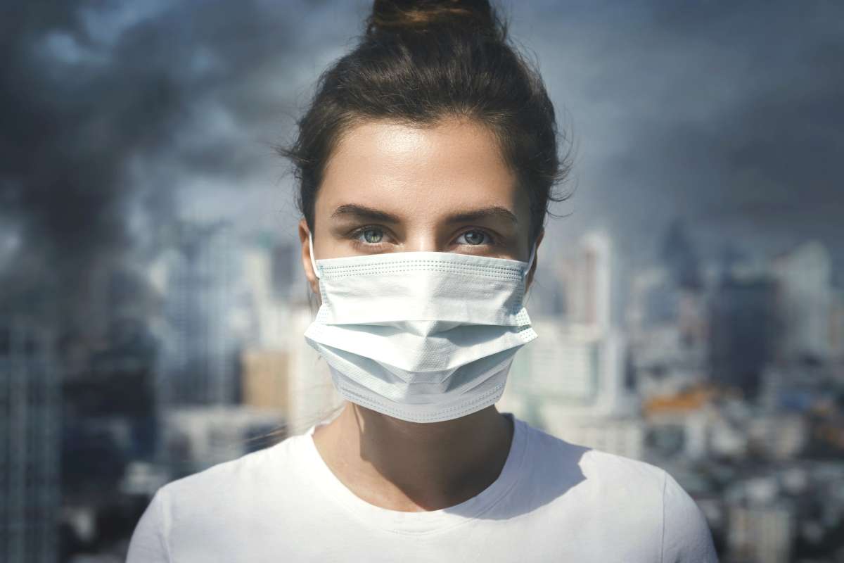 woman inhaling toxins
