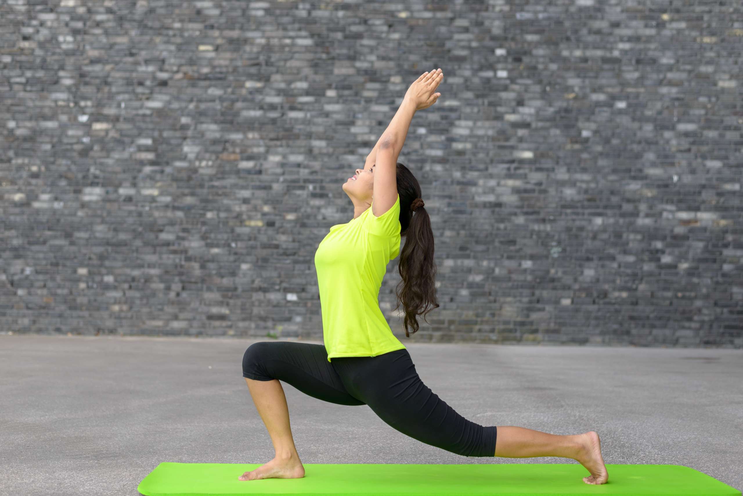 Fit athletic young woman doing yoga exercises- Pelvic Health Before Conception