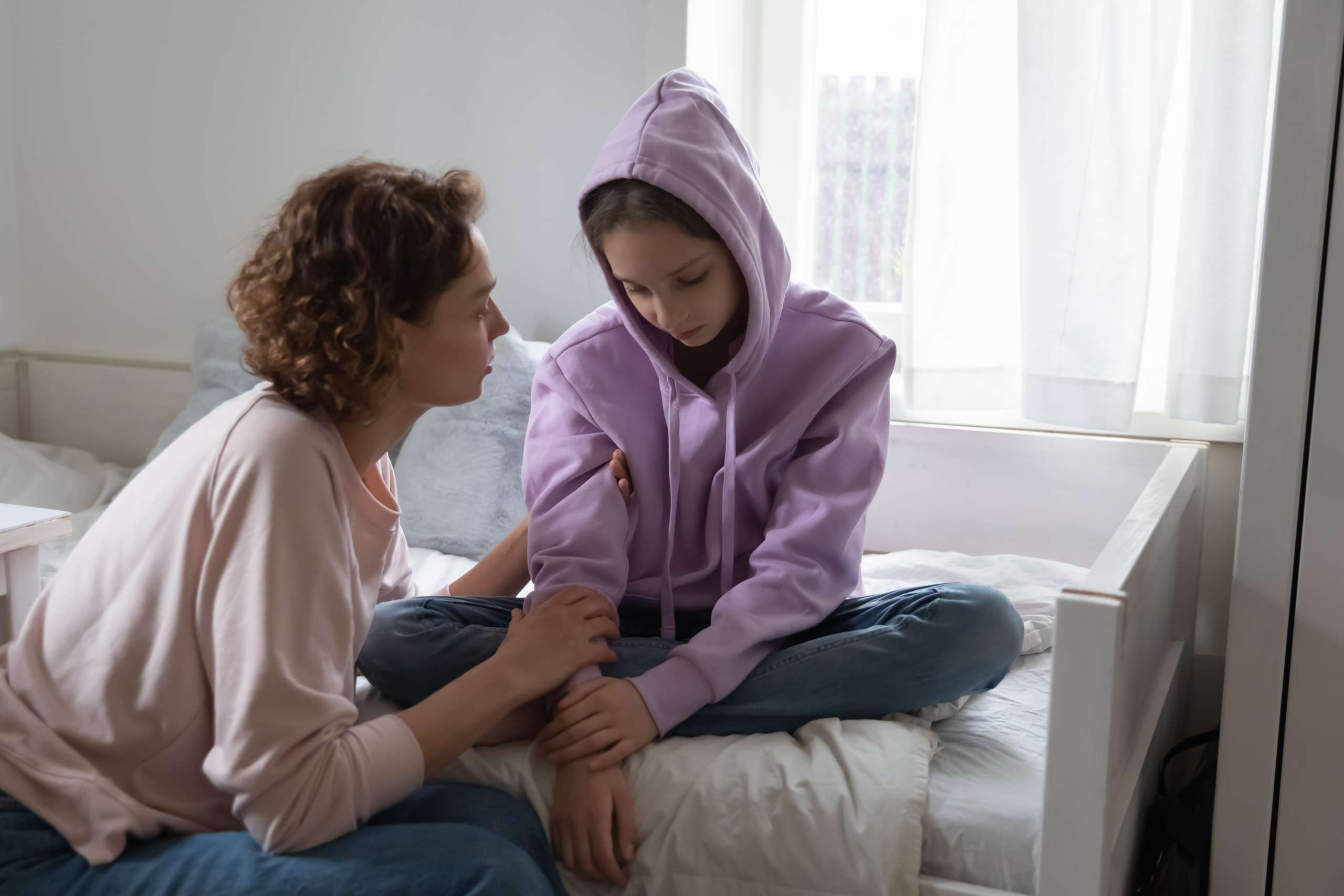 Affectionate young mommy supporting stressed teen daughter- PCOD And PCOS On Adolescence
