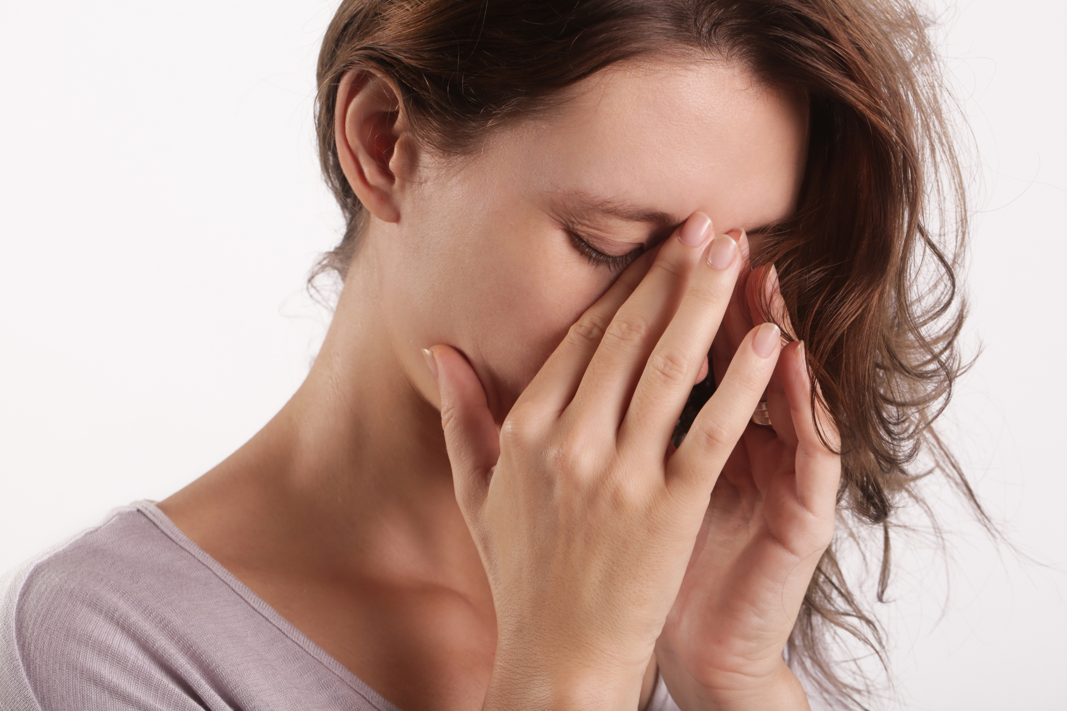 young woman suffering from symptoms of sinus Infection (Sinusitis)