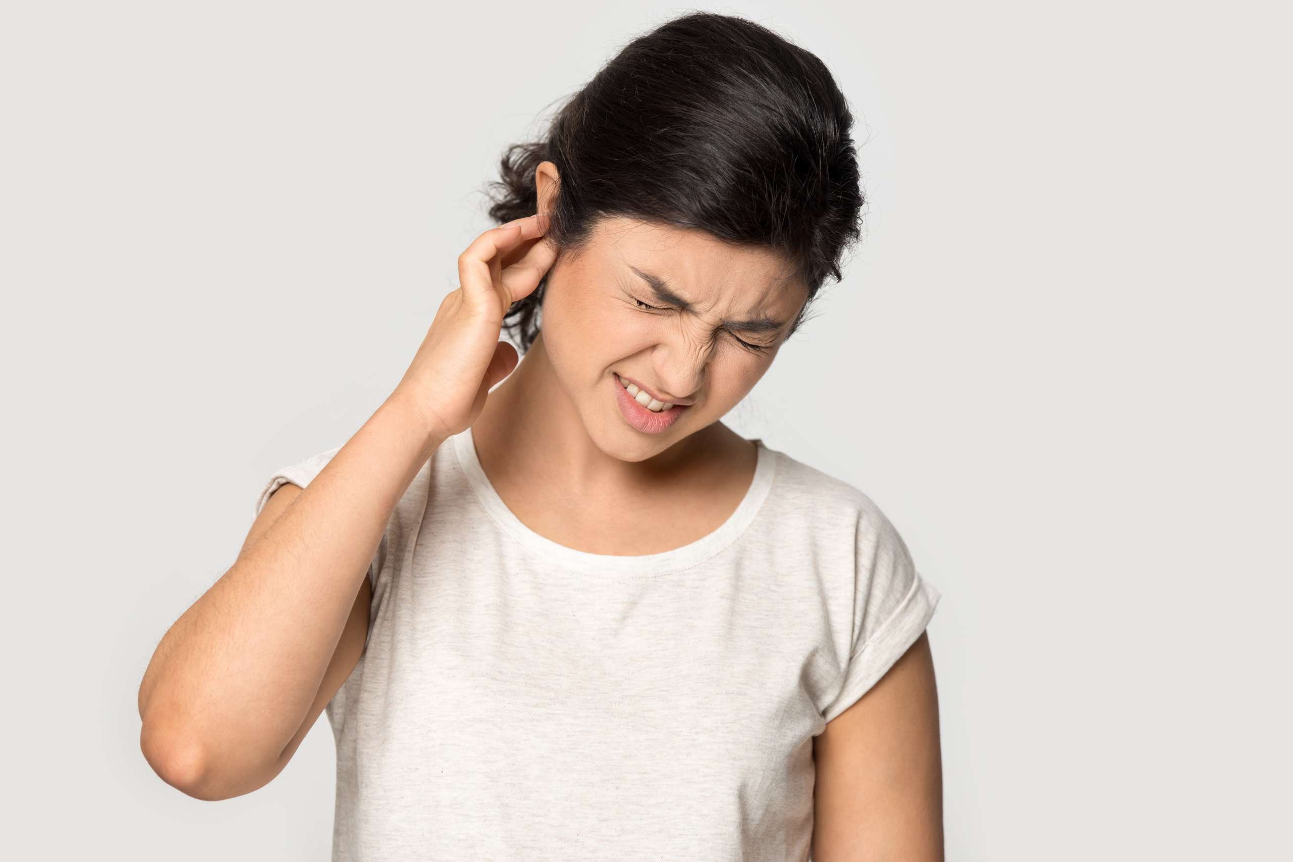  millennial lady suffering from strong earache.